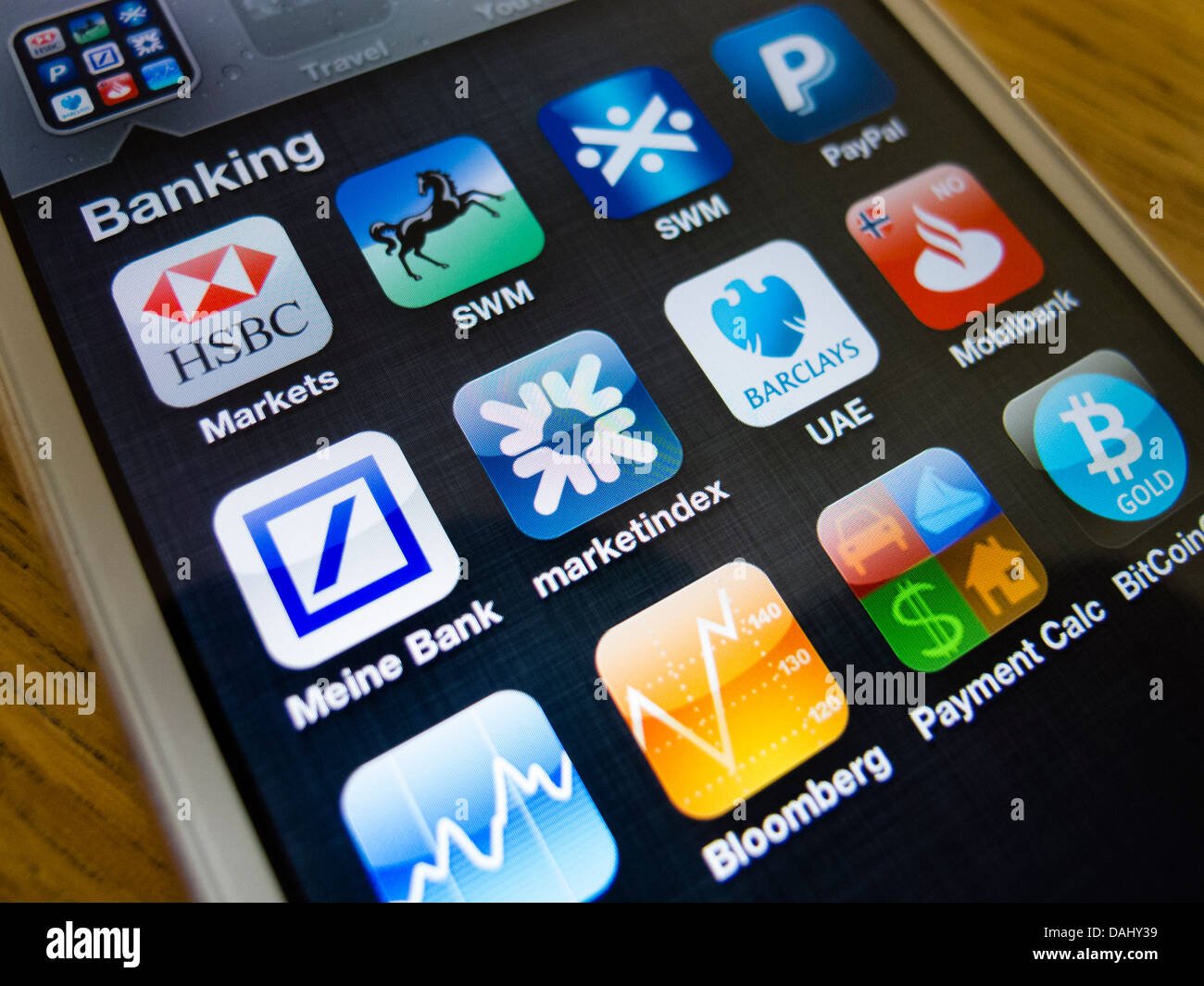 using-white-iphone-5-smartphone-to-access-many-banking-apps-from-home-DAHY39.jpg